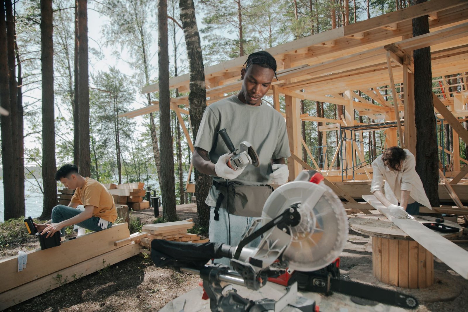 Crew building a timber structure outdoors