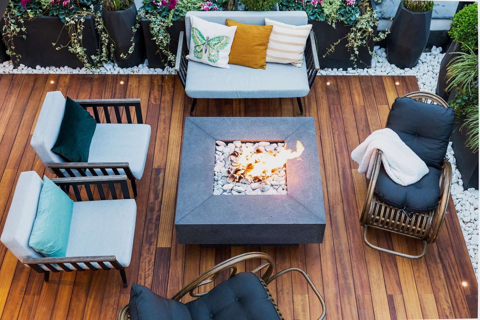 Overhead view of a deck with seating around a central fire pit