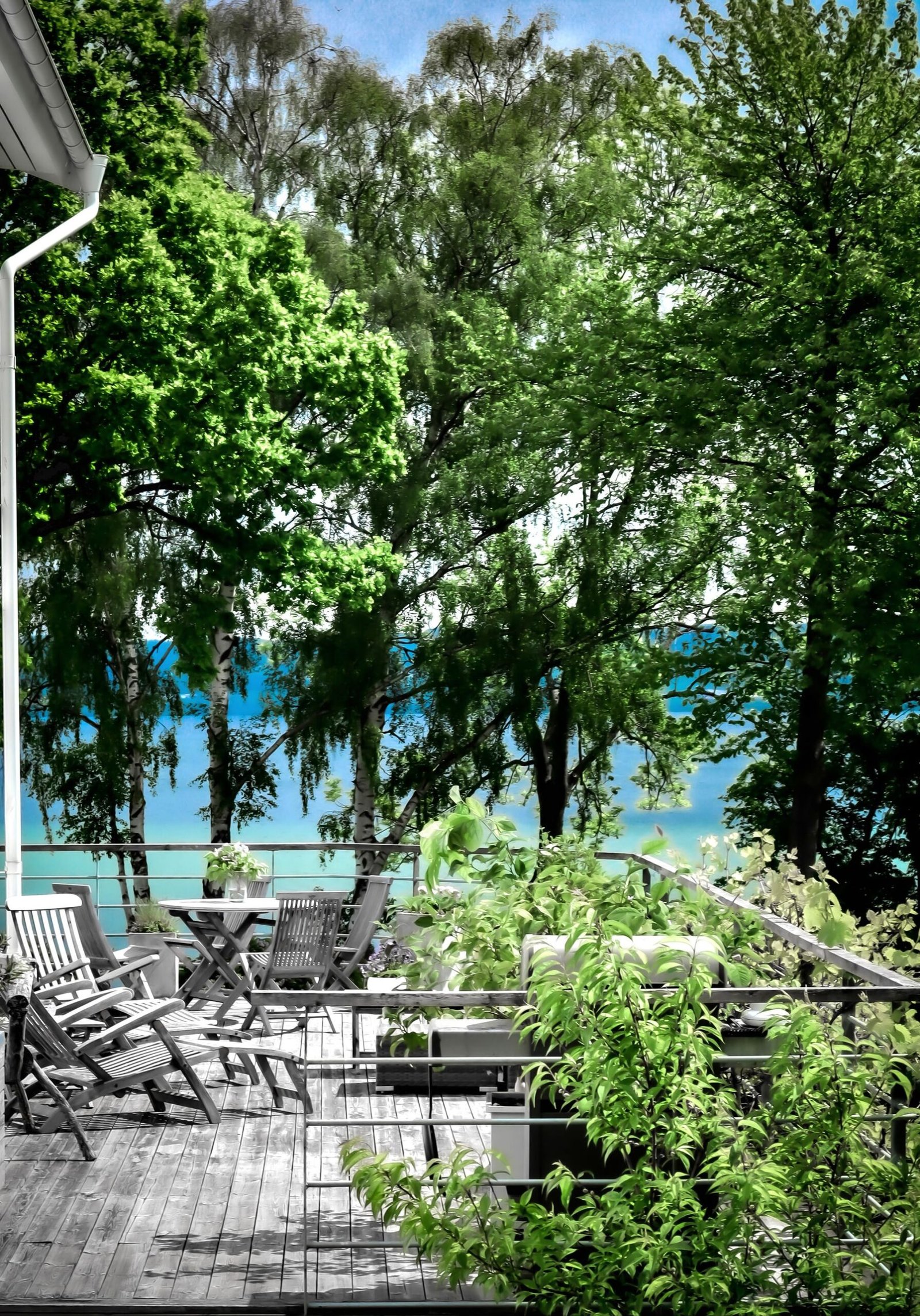 Covered deck with seating looking out over greenery